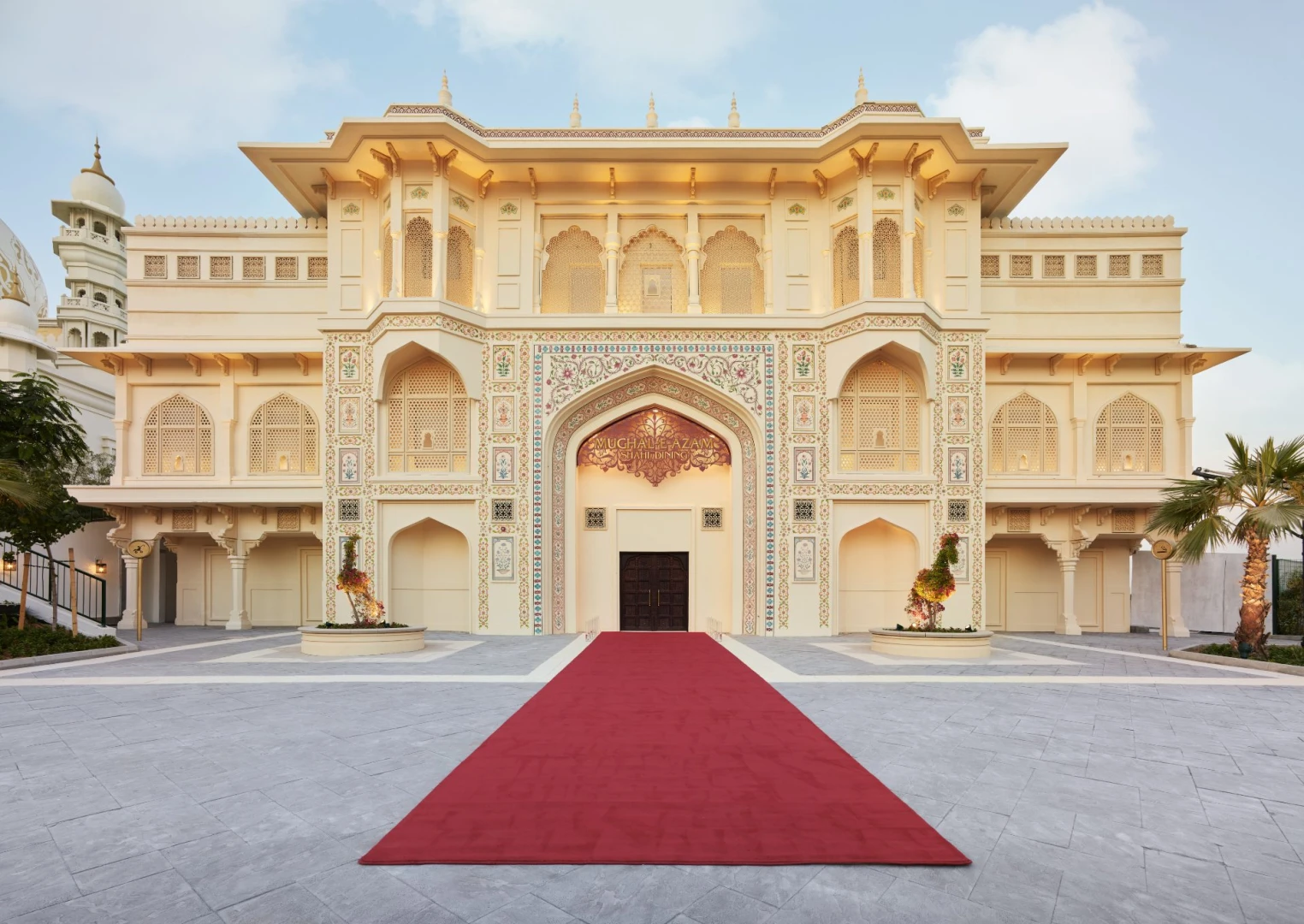 Ornate building facade with red carpet at Dubai Parks and Resorts, Dubai, UAE.