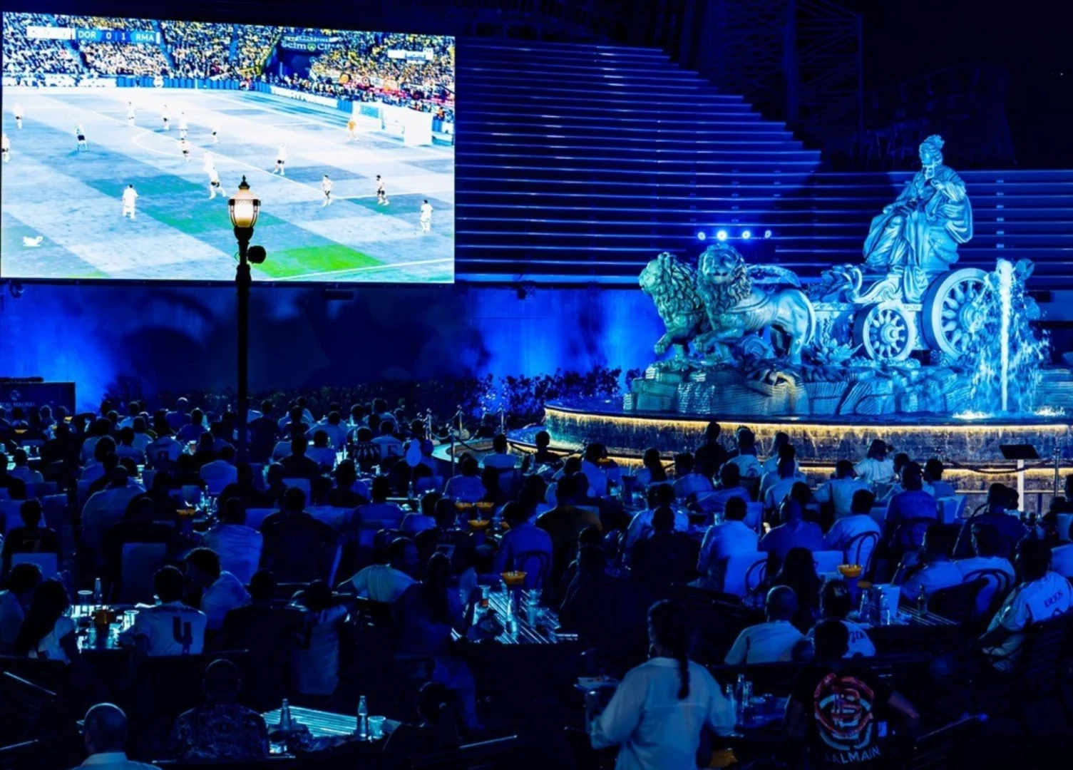 Outdoor event space with large screen and statue at Dubai Parks and Resorts, Dubai