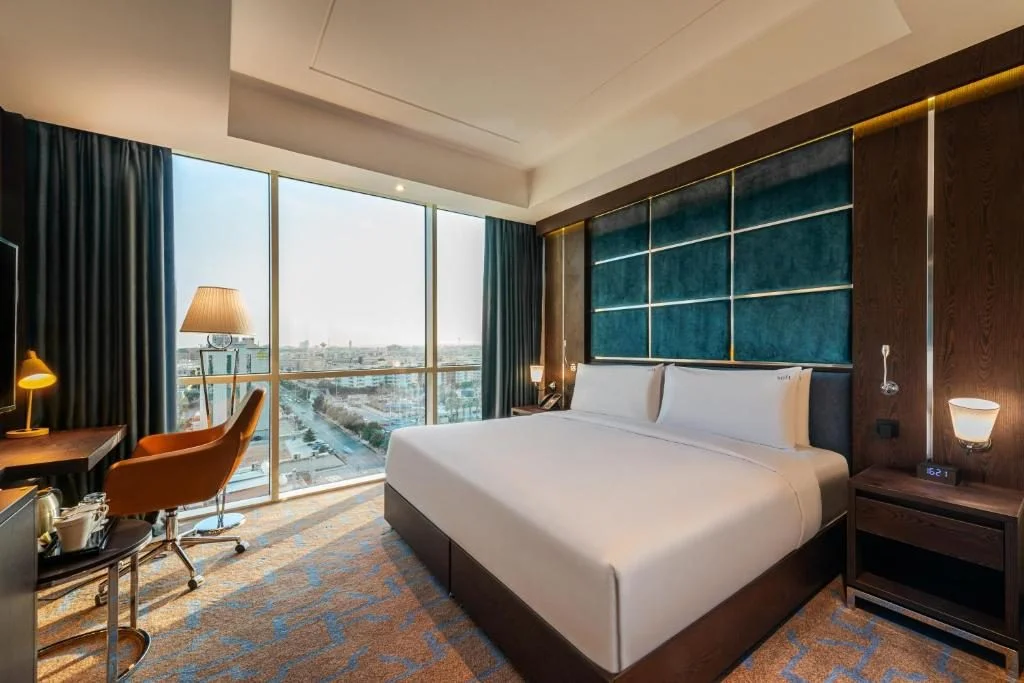 Elegant guest room with city view at Holiday Inn Riyadh al Malaz, Riyadh.