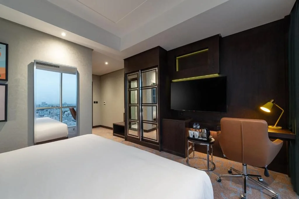 Guest room with modern decor at Holiday Inn Riyadh al Malaz by IHG, Riyadh