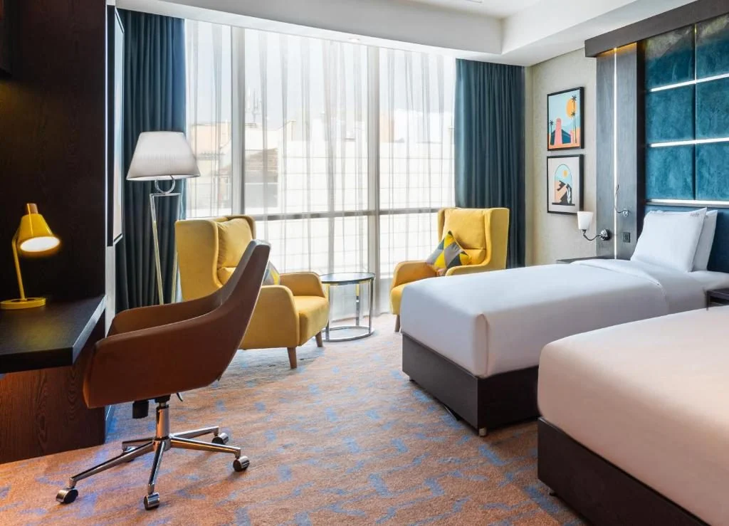 Modern guest room with twin beds at Holiday Inn Riyadh al Malaz, Riyadh.