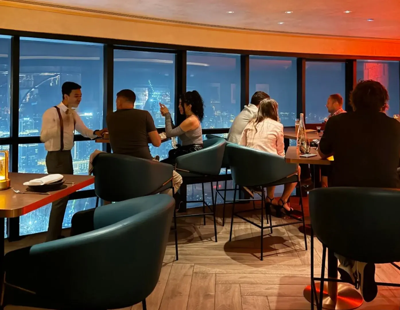 Guests enjoying city view at Observatory Lounge, Dubai, UAE