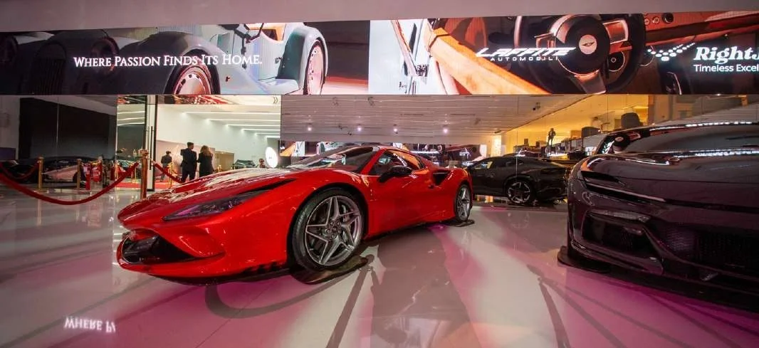 Luxury sports cars displayed at Aureum Club, Dubai, UAE.