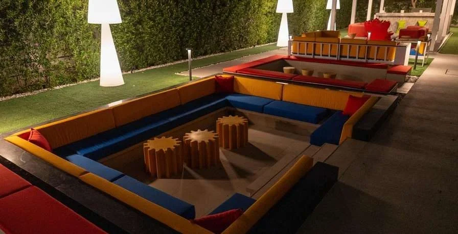 Outdoor seating area with colorful cushions at Aureum Club, Dubai, UAE